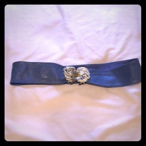 Vintage adjustable blue leather belt with statement buckle
